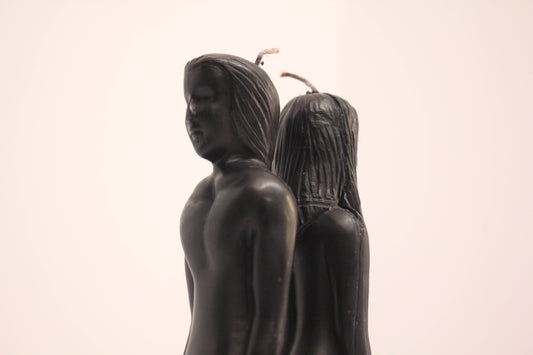 Black Man and Woman Facing Away From Each Other Candle